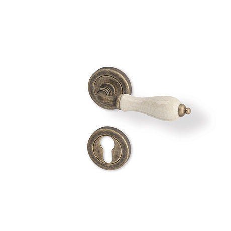 Antik R - matt bronze patina/ porcelain - Door Handle on a Round Rose