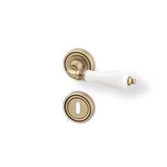 Baroque R - bronze / porcelain - Door Handle on a Round Rose