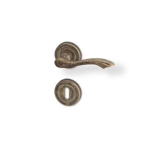 Rustik R - matt bronze patina - Door Handle on a Round Rose